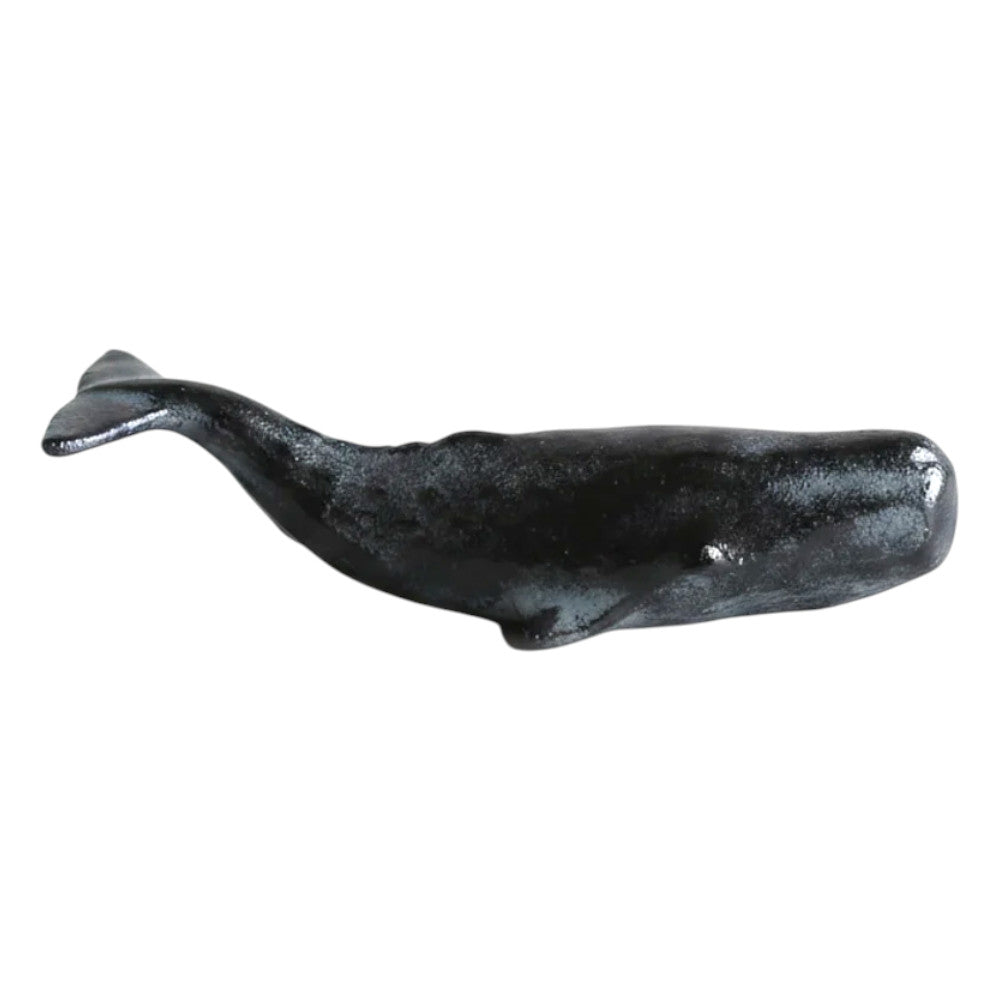 Cast Iron Whale Paper Weight with red accent on a white background