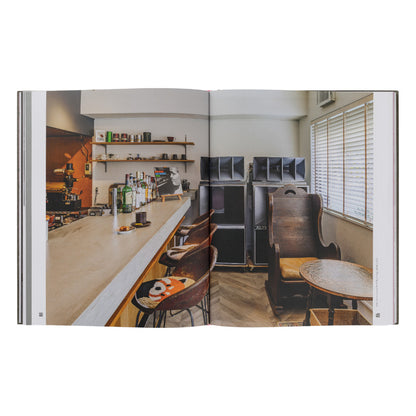 Open book showing a interior design layout with a bar area and seating.