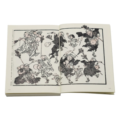 Open book with black and white illustrations of characters on a white background