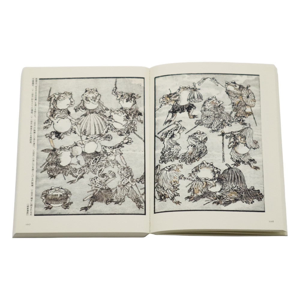 Open book with black and white illustrations on a white background